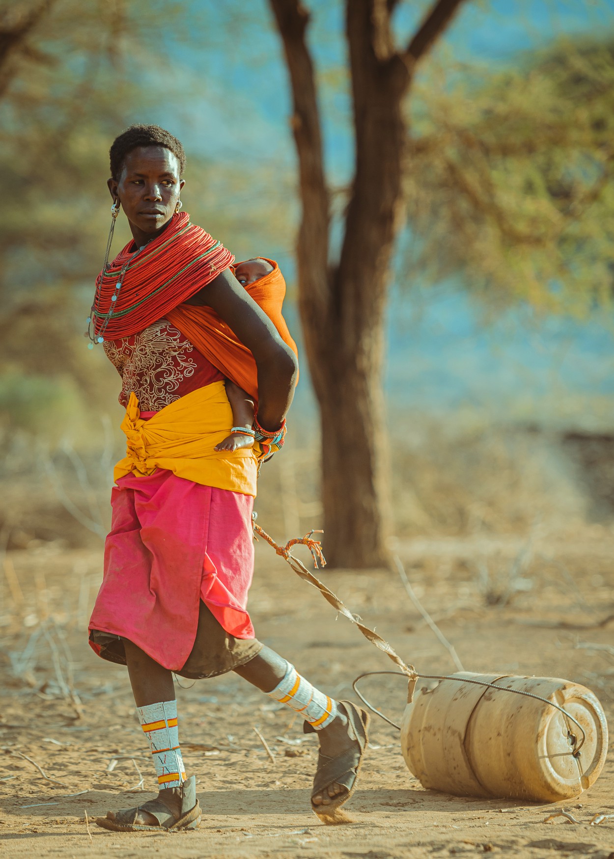 Steps Through Dust: Samburu Woman Fetching Water